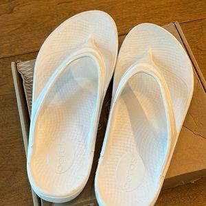 Oofos white flip flops